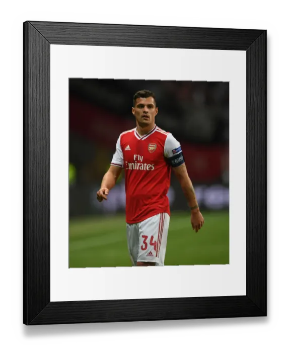 Framed Print : Granit Xhaka's Brilliant Midfield Performance: Arsenal Triumphs Over Eintracht Frankfurt in Europa League