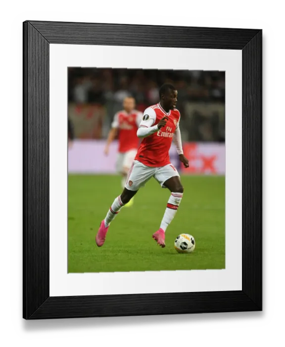 Framed Print : Arsenal's Nicolas Pepe in Action against Eintracht Frankfurt in UEFA Europa League Group F Framed Print : Arsenal's Nicolas Pepe in Action against Eintracht Frankfurt in UEFA Europa League Group F
