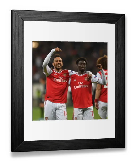 Framed Print : Arsenal's Aubameyang and Saka Celebrate Goals in Europa League Victory over Eintracht Frankfurt Framed Print : Arsenal's Aubameyang and Saka Celebrate Goals in Europa League Victory over Eintracht Frankfurt