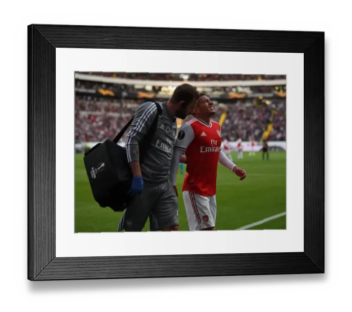 Framed Print : Arsenal's Lucas Torreira Receives Treatment from Physio during Eintracht Frankfurt Clash (UEFA Europa League 2019-20) Framed Print : Arsenal's Lucas Torreira Receives Treatment from Physio during Eintracht Frankfurt Clash (UEFA Europa League 2019-20)