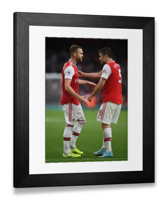 Framed Print : Arsenal's Chambers and Sokratis: Post-Match Moment at Emirates Stadium (Arsenal v Aston Villa, 2019-20) Framed Print : Arsenal's Chambers and Sokratis: Post-Match Moment at Emirates Stadium (Arsenal v Aston Villa, 2019-20)