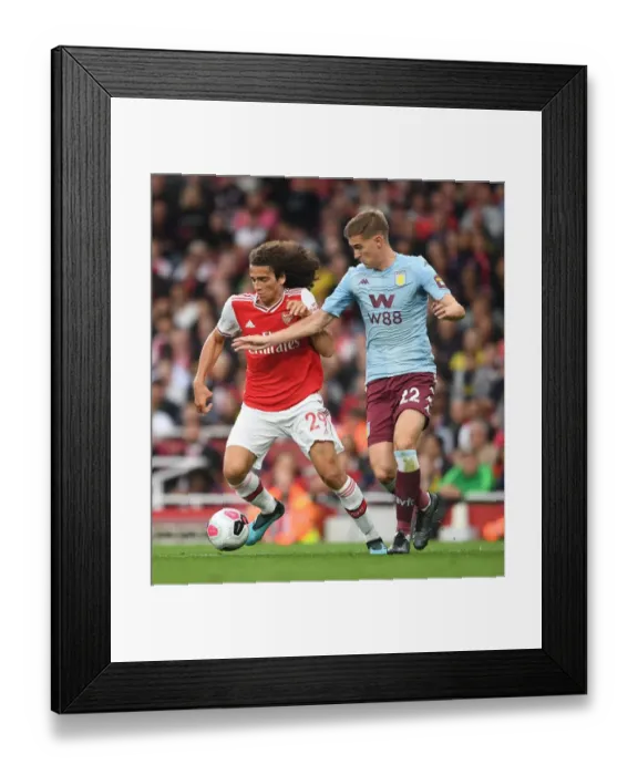 Framed Print : Guendouzi vs Engels: A Premier League Battle at Emirates Stadium