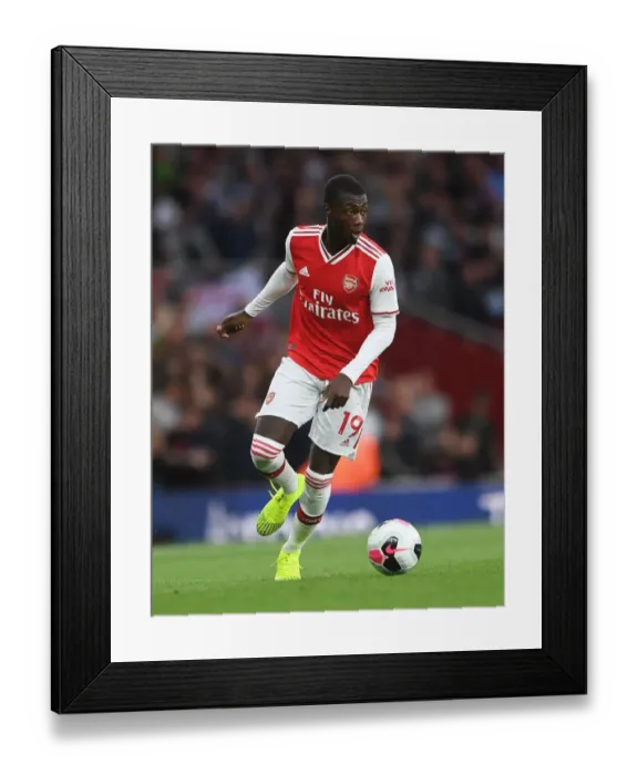 Framed Print : Arsenal's Nicolas Pepe Shines in Premier League Clash Against Aston Villa