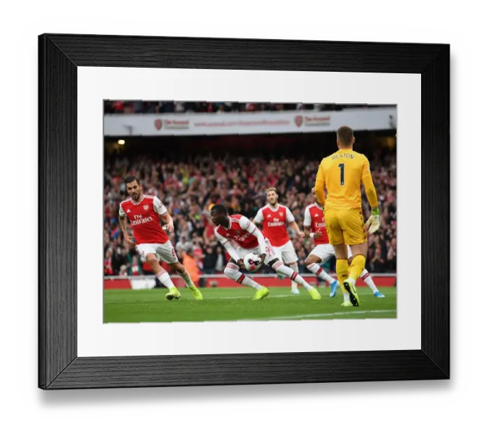Framed Print : Nicolas Pepe gabs the ball after scoring Arsenals 1st goal Framed Print : Nicolas Pepe gabs the ball after scoring Arsenals 1st goal