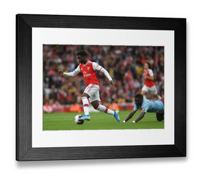 Framed Print : Saka vs. Nakamba: A Premier League Battle at the Emirates