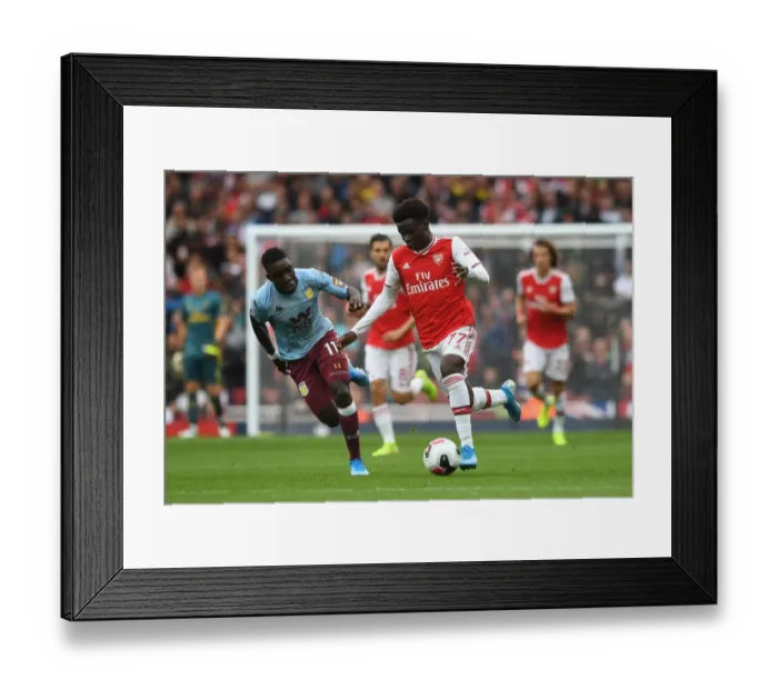 Framed Print : Saka vs. Nakamba: Intense Face-Off in Arsenal vs. Aston Villa Premier League Clash