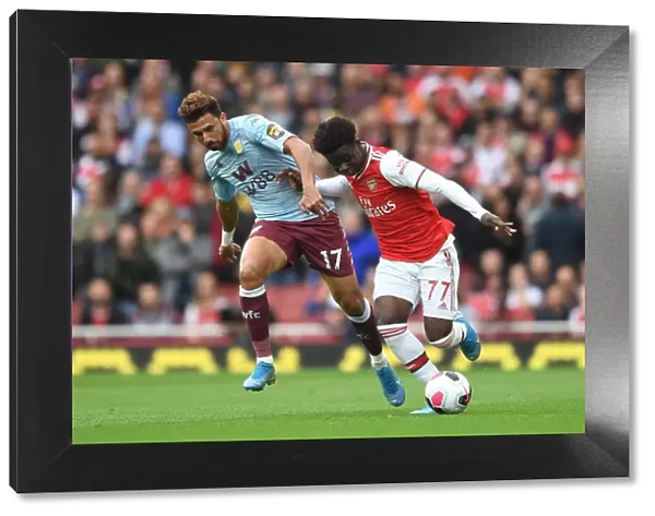 Saka vs Trezeguet: Intense Face-Off in Arsenal's Battle Against Aston Villa