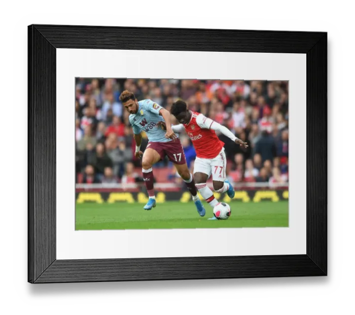 Framed Print : Saka vs Trezeguet: Intense Face-Off in Arsenal's Battle Against Aston Villa Framed Print : Saka vs Trezeguet: Intense Face-Off in Arsenal's Battle Against Aston Villa