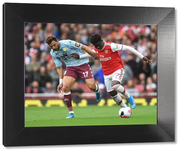 Arsenal's Bukayo Saka Clashes with Aston Villa's Trezeguet in Premier League Showdown