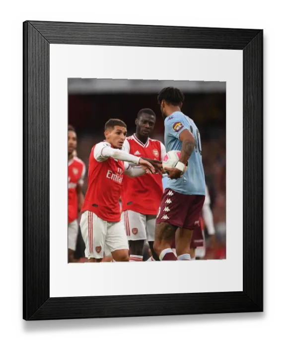 Framed Print : Arsenal vs Aston Villa: Torreira and Pepe Battle Mings in Premier League Clash Framed Print : Arsenal vs Aston Villa: Torreira and Pepe Battle Mings in Premier League Clash
