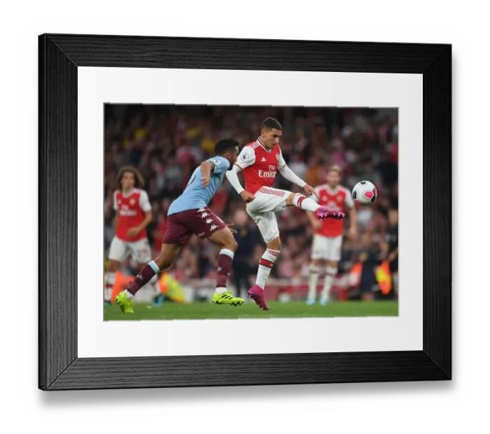 Framed Print : Arsenal's Torreira Fends Off Aston Villa's Taylor Amidst Premier League Battle
