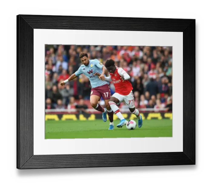 Framed Print : Saka vs Trezeguet: A Premier League Battle at Emirates Stadium