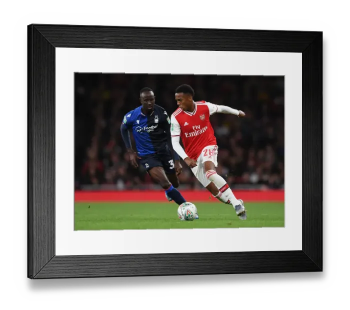 Framed Print : Arsenal's Joe Willock vs. Nottingham Forest's Albert Adomah: A Carabao Cup Battle at Emirates Stadium Framed Print : Arsenal's Joe Willock vs. Nottingham Forest's Albert Adomah: A Carabao Cup Battle at Emirates Stadium