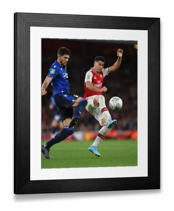 Framed Print : Arsenal's Martinelli Closes In on Nottingham Forest's Figueiredo in Carabao Cup Showdown Framed Print : Arsenal's Martinelli Closes In on Nottingham Forest's Figueiredo in Carabao Cup Showdown