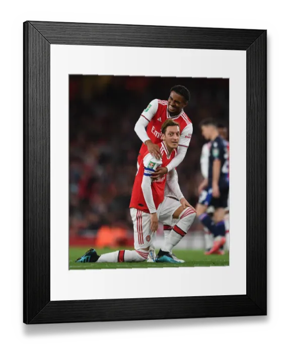 Framed Print : Arsenal's Ozil and Nelson in Action: Clash Against Nottingham Forest in Carabao Cup