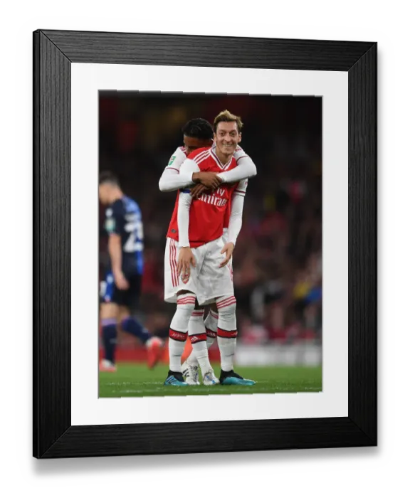 Framed Print : Arsenal's Ozil and Nelson in Action: Battling Nottingham Forest in Carabao Cup Clash