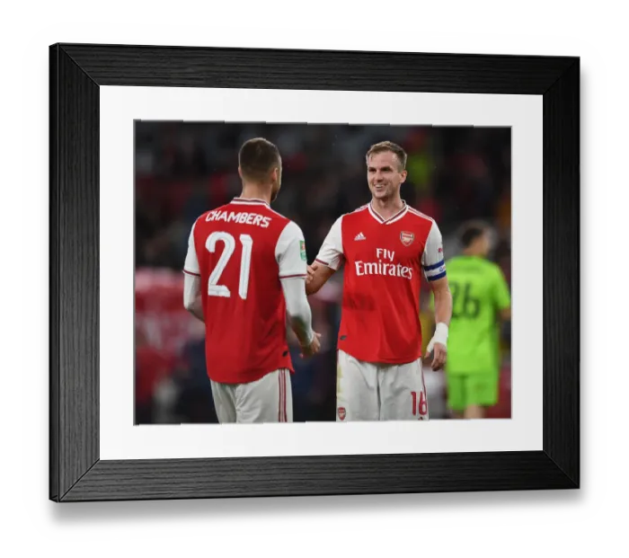 Framed Print : Arsenal's Holding and Chambers Celebrate Carabao Cup Victory over Nottingham Forest