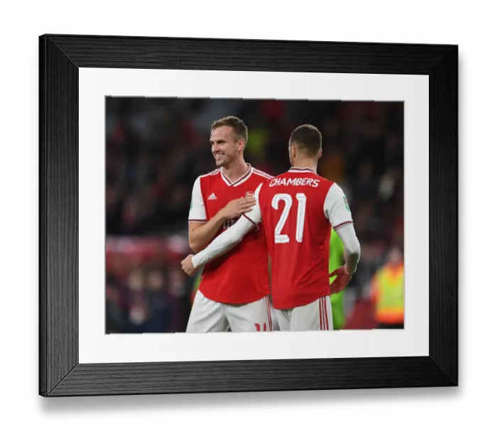 Framed Print : Arsenal: Holding and Chambers Embrace Carabao Cup Victory