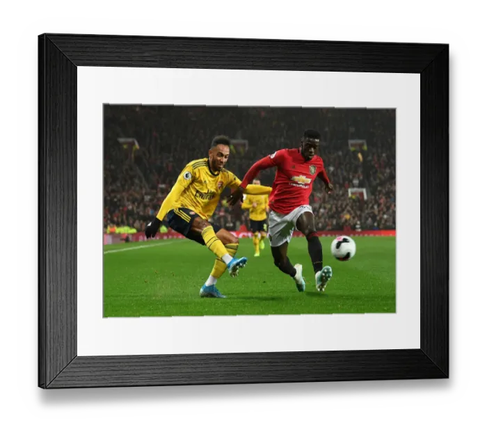 Framed Print : Aubameyang vs. Tuanzebe: Intense Clash at Old Trafford - Manchester United vs. Arsenal (Premier League 2019-20)
