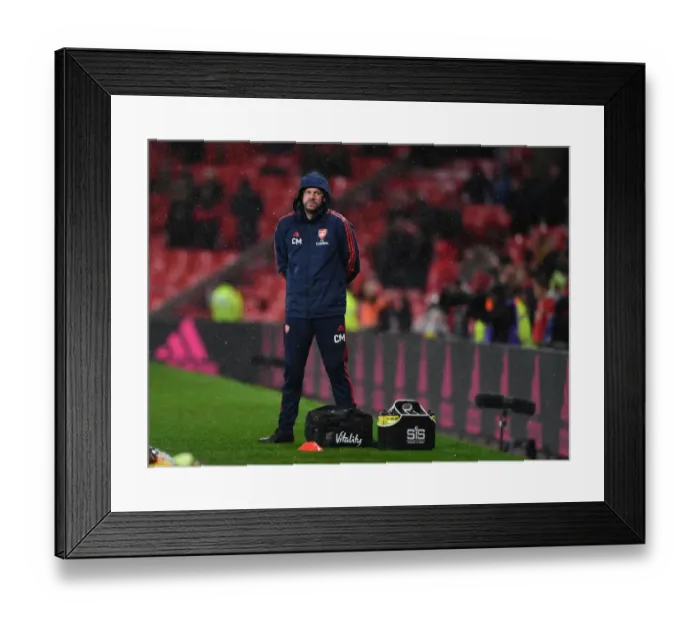 Framed Print : Arsenal's Chris Morgan Tends to Injured Player during Manchester United vs Arsenal (2019-20)