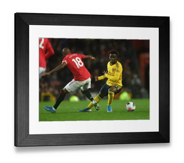 Framed Print : Clash of Wings: Saka vs Young - Premier League Showdown (2019-20) - Manchester United vs Arsenal Framed Print : Clash of Wings: Saka vs Young - Premier League Showdown (2019-20) - Manchester United vs Arsenal