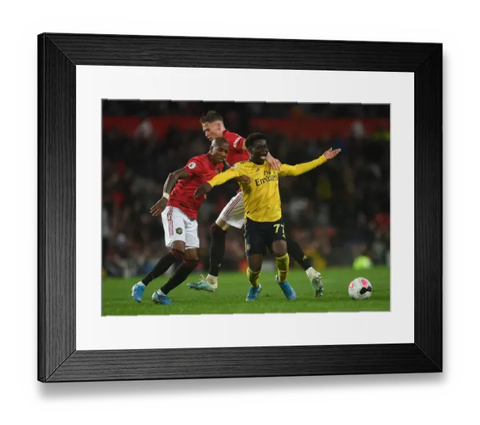 Framed Print : Manchester United vs. Arsenal: Bukayo Saka Fouls by McTominay in 2019-20 Premier League Clash Framed Print : Manchester United vs. Arsenal: Bukayo Saka Fouls by McTominay in 2019-20 Premier League Clash