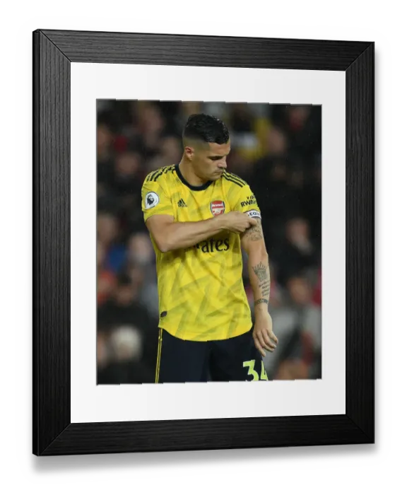 Framed Print : Xhaka at Old Trafford: Battle of Manchester United vs. Arsenal in Premier League 2019-20