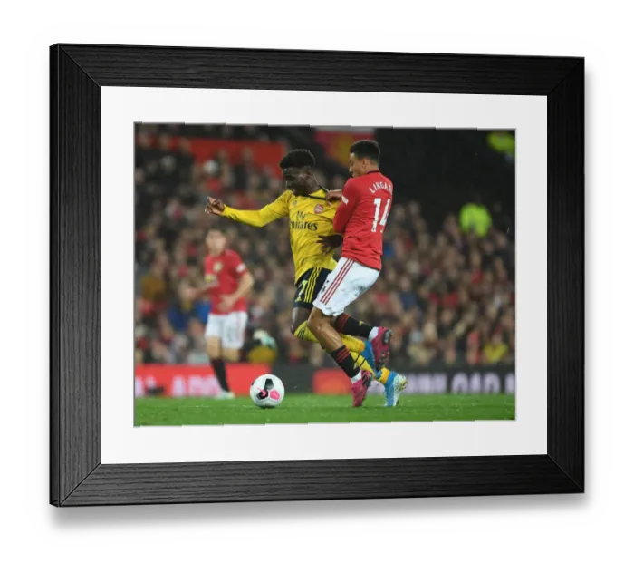 Framed Print : Clash of Wings: Saka vs Young - Manchester United vs Arsenal Premier League Showdown Framed Print : Clash of Wings: Saka vs Young - Manchester United vs Arsenal Premier League Showdown