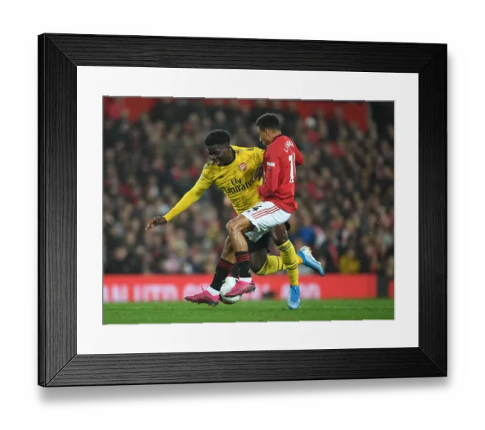 Framed Print : Clash of Wings: Saka vs Young - Premier League Battle at Old Trafford