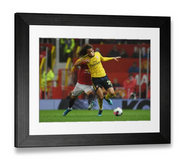 Framed Print : Manchester United vs. Arsenal: Guendouzi vs. Pereira Clash in Premier League Showdown Framed Print : Manchester United vs. Arsenal: Guendouzi vs. Pereira Clash in Premier League Showdown