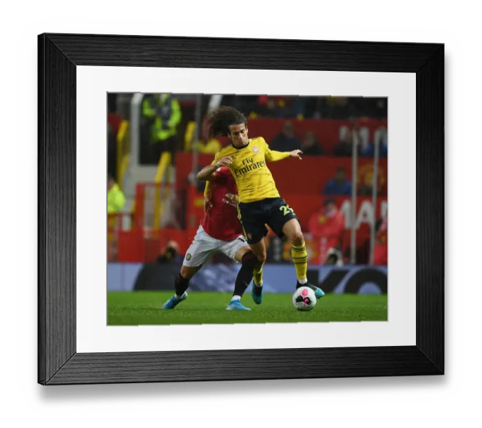 Framed Print : Premier League Showdown: Manchester United vs. Arsenal (2019-20) - Clash at Old Trafford: A Battle of Wits and Skills