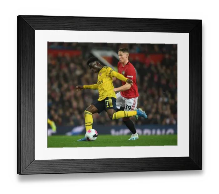 Framed Print : Bukayo Saka vs. Scott McTominay: Manchester United vs. Arsenal FC - Premier League Showdown (2019-20) Framed Print : Bukayo Saka vs. Scott McTominay: Manchester United vs. Arsenal FC - Premier League Showdown (2019-20)