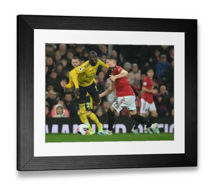 Framed Print : Pepe Foul: McTominay vs Arsenal's Nicolas Pepe (Manchester United vs Arsenal, Premier League 2019-20) Framed Print : Pepe Foul: McTominay vs Arsenal's Nicolas Pepe (Manchester United vs Arsenal, Premier League 2019-20)