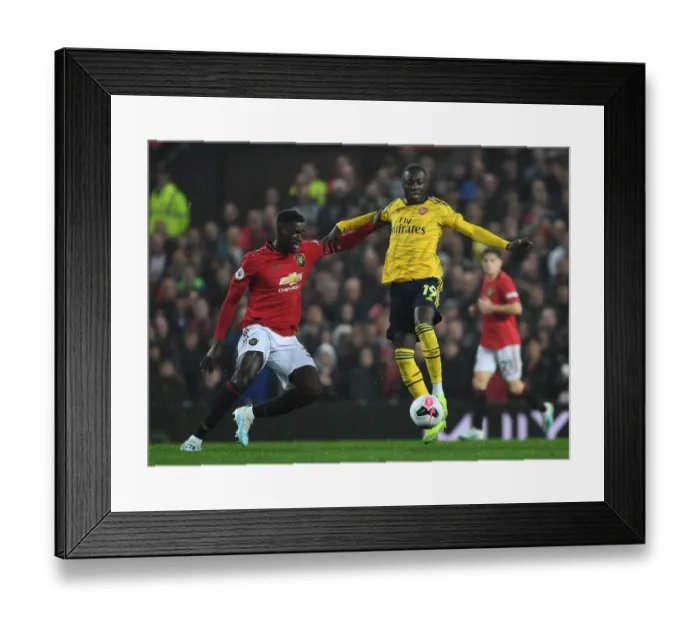 Framed Print : Manchester United vs Arsenal: Pepe vs Tuanzebe Clash in Premier League Showdown Framed Print : Manchester United vs Arsenal: Pepe vs Tuanzebe Clash in Premier League Showdown