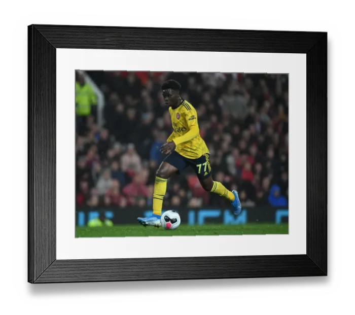 Framed Print : Bukayo Saka in Action: Manchester United vs. Arsenal, Premier League 2019-20 Framed Print : Bukayo Saka in Action: Manchester United vs. Arsenal, Premier League 2019-20