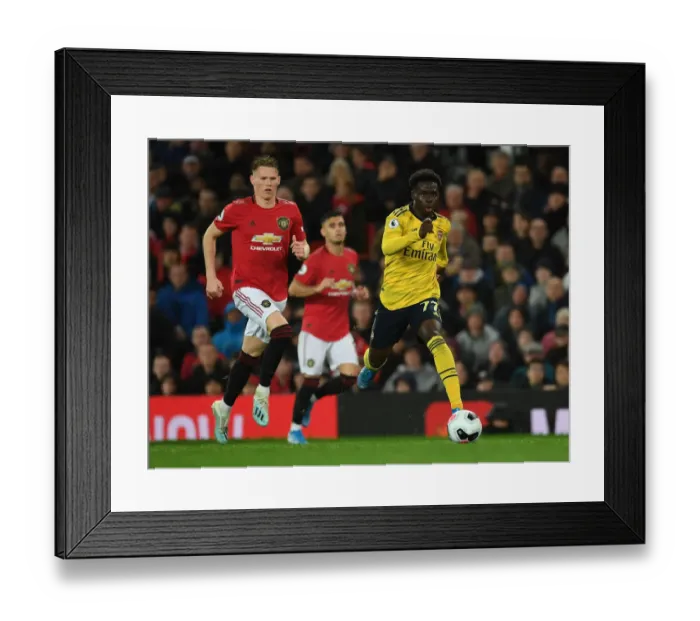 Framed Print : Bukayo Saka Darts Past Scott McTominay: Manchester United vs. Arsenal, Premier League 2019-20 Framed Print : Bukayo Saka Darts Past Scott McTominay: Manchester United vs. Arsenal, Premier League 2019-20