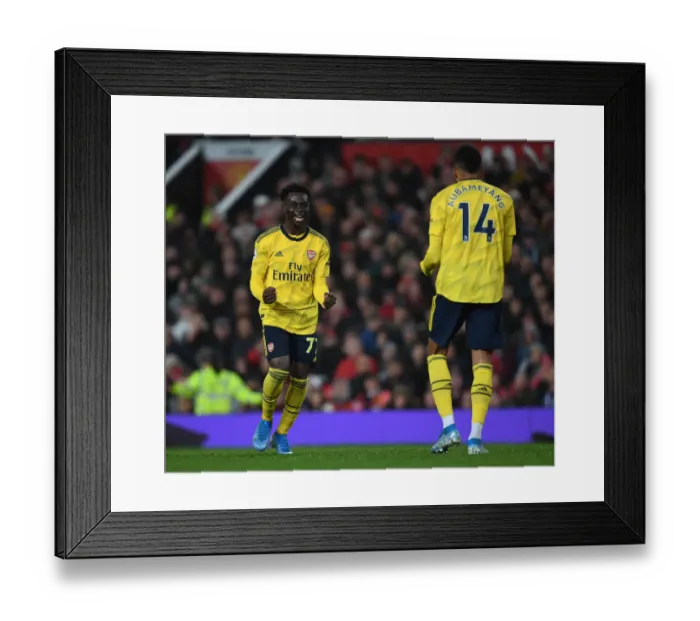 Framed Print : Aubameyang and Saka's Goal Celebration: Manchester United vs. Arsenal (2019-20)