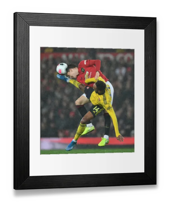 Framed Print : Manchester United vs. Arsenal: Aubameyang vs. Lindelof Clash in Premier League Showdown