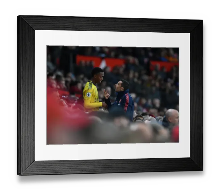 Framed Print : Arsenal Assistant Coach Juan Carlos Cardedo Conferring with Joe Willock during Manchester United vs Arsenal (2019-20)