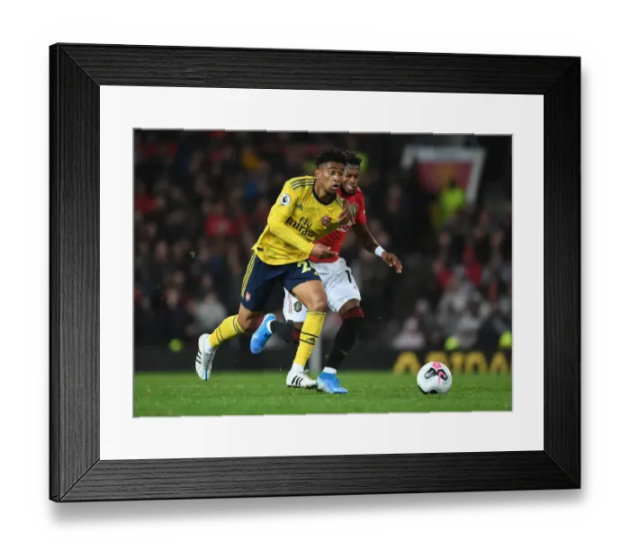 Framed Print : Reiss Nelson Outsmarts Fred: A Premier League Showdown - Manchester United vs. Arsenal (2019-20) Framed Print : Reiss Nelson Outsmarts Fred: A Premier League Showdown - Manchester United vs. Arsenal (2019-20)