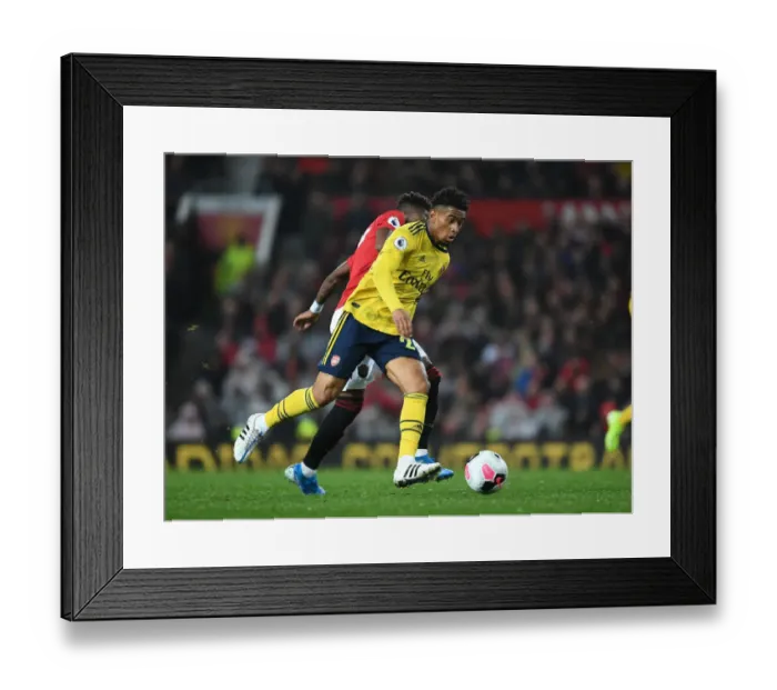 Framed Print : Reiss Nelson Breaks Past Fred: Manchester United vs. Arsenal - Premier League Showdown (2019-20)