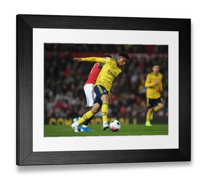 Framed Print : Reiss Nelson Outsmarts Fred: Arsenal's Triumph over Manchester United (2019-20)