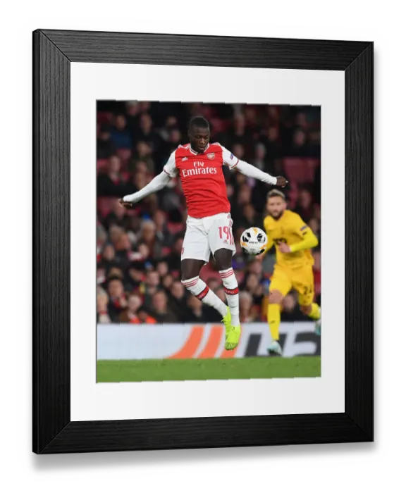 Framed Print : Arsenal's Nicolas Pepe Shines: Arsenal Crush Standard Liege in Europa League