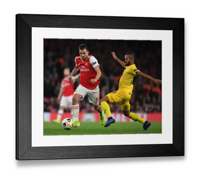 Framed Print : Arsenal's Dani Ceballos Outmaneuvers Standard Liege's Mehdi Carcela in Europa League Clash