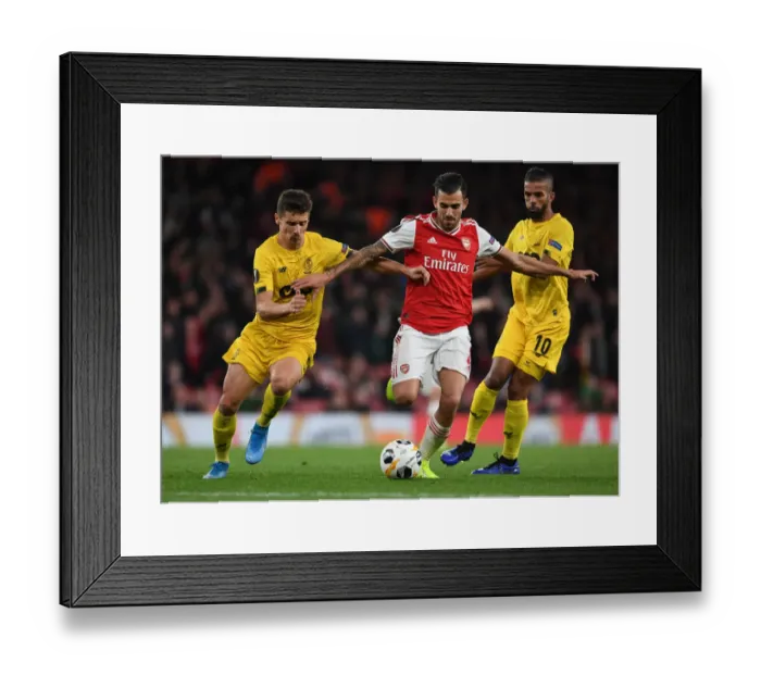 Framed Print : Arsenal's Dani Ceballos Faces Off Against Standard Liege's Aleksander Boljevic in Europa League Clash
