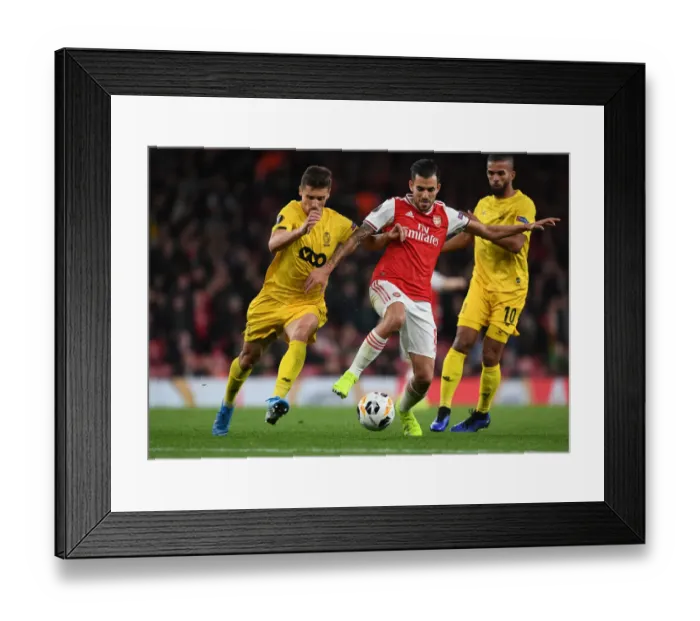 Framed Print : Arsenal's Dani Ceballos Clashes with Standard Liege's Aleksander Boljevic in Europa League Showdown