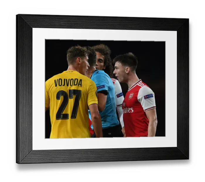 Framed Print : Clash of Defenders: Tierney vs Vojvoda - Arsenal vs Standard Liege, Europa League