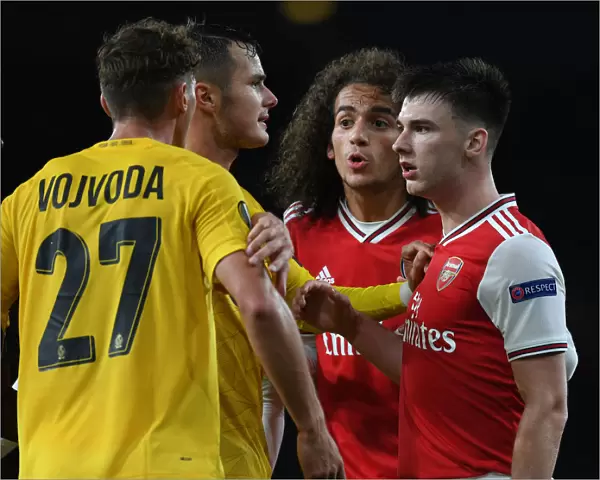 Arsenal vs Standard Liege: Clash Between Kieran Tierney and Mergim Vojvoda in Europa League Match