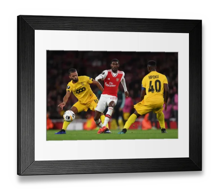 Framed Print : Arsenal Under Pressure: Ainsley Maitland-Niles Faces Off Against Mehdi Carcela in Europa League Clash Framed Print : Arsenal Under Pressure: Ainsley Maitland-Niles Faces Off Against Mehdi Carcela in Europa League Clash