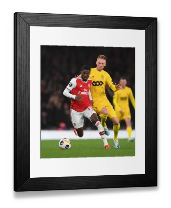 Framed Print : Arsenal vs Standard Liege: Ainsley Maitland-Niles Clashes with Renaud Emond in UEFA Europa League Match Framed Print : Arsenal vs Standard Liege: Ainsley Maitland-Niles Clashes with Renaud Emond in UEFA Europa League Match